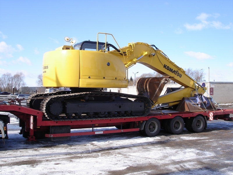 Low-bed with tracked excavator